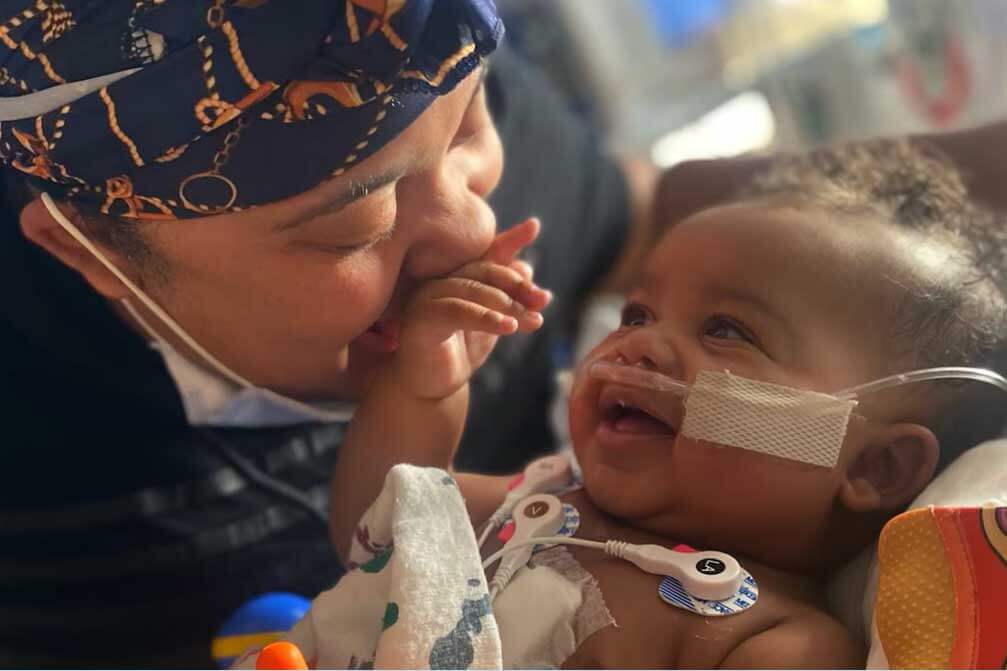 Smiling doctor with happy baby