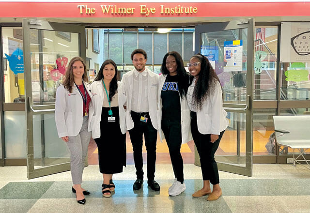 Below: Wilmer Diversity Scholars Class of 2022 Left to right, Amanda Martinez, Kailyn Ramiriez, Dimitri Johnson, Temi Adeleke and Rebecca Mirville