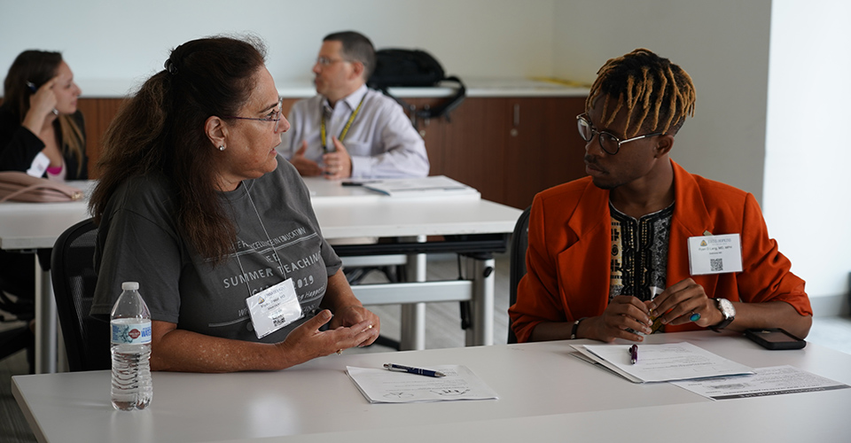 attendees work together during teaching camp