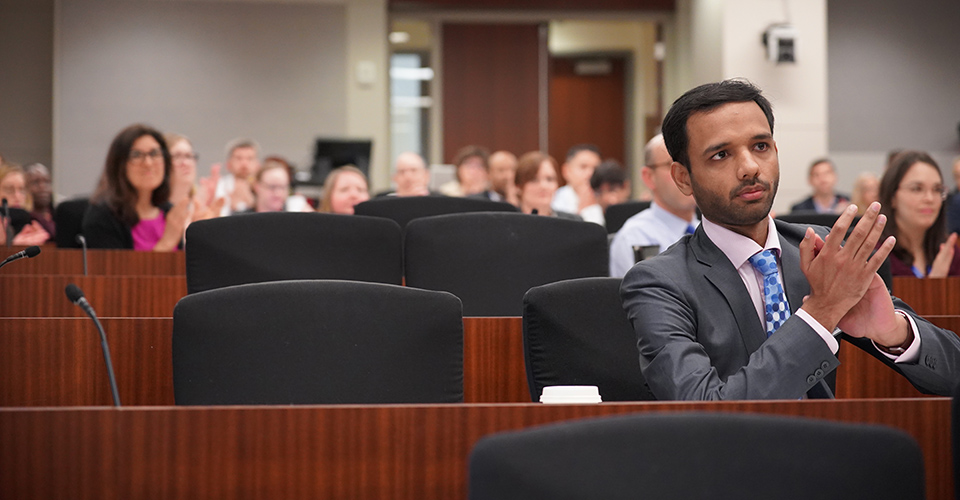 attendees listen during conference