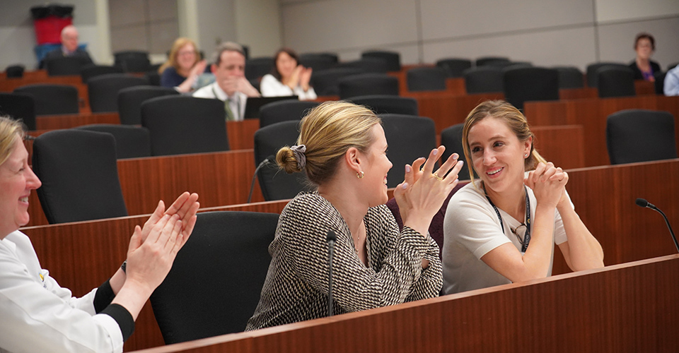 attendees talk during conference