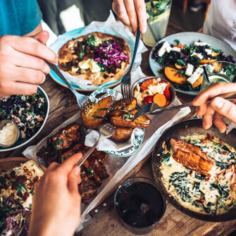 Friends sharing food.