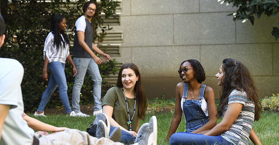 students sitting on the graduate student lawn