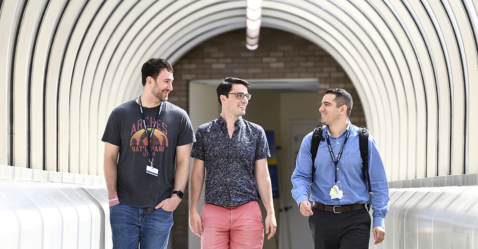 Graduate students walking to their lab