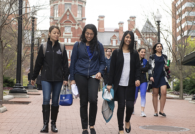 Students walk outside.