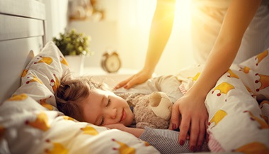 child laying in bed