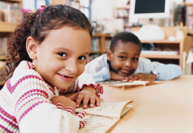 boy and girl at a desk