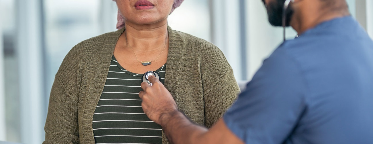 A woman gets her heart checked by her doctor at an appointment