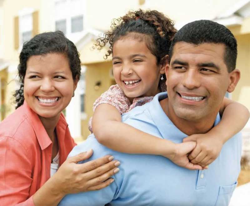 family of three laughing