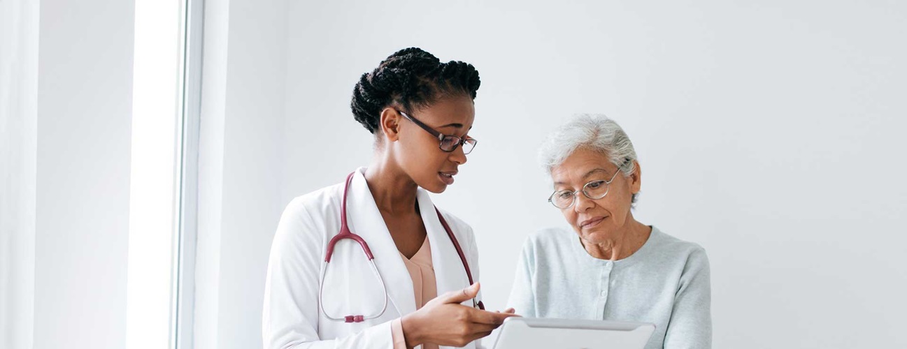 Doctor and patient discuss test results together.