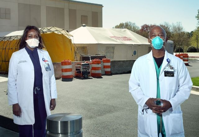 Masked providers at vaccination site