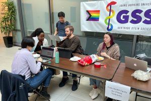 Members of the School of Medicine at a table for GSS