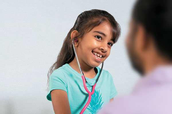 Mahi playing doctor with her parent