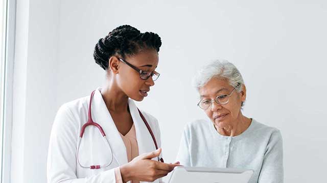 Woman speaks with doctor