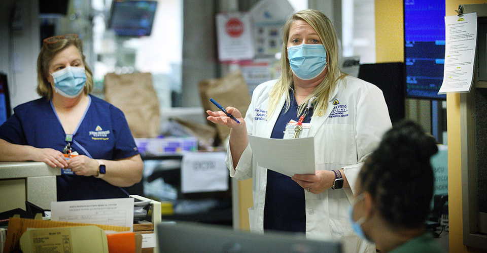 Faculty during a huddle on the wards.