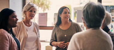 Women standing and talking.