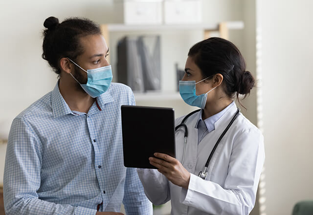 a man talking to a doctor