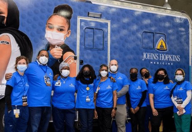 Mobile vaccination team in front of trailer